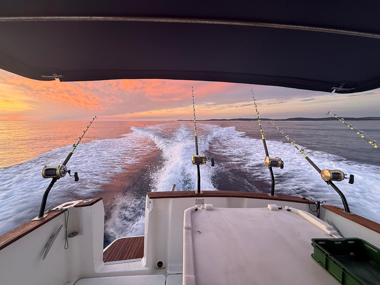 Trolling rods deployed at sunset offshore Istria